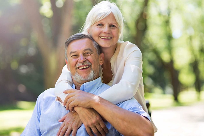 Older couple reviewing paperwork at home